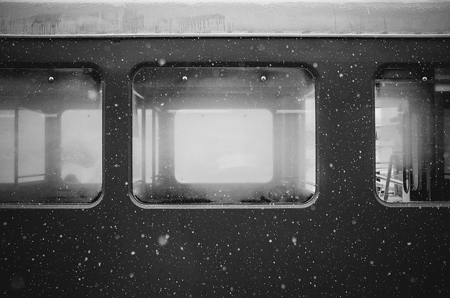 Empty train wagon in the rain.